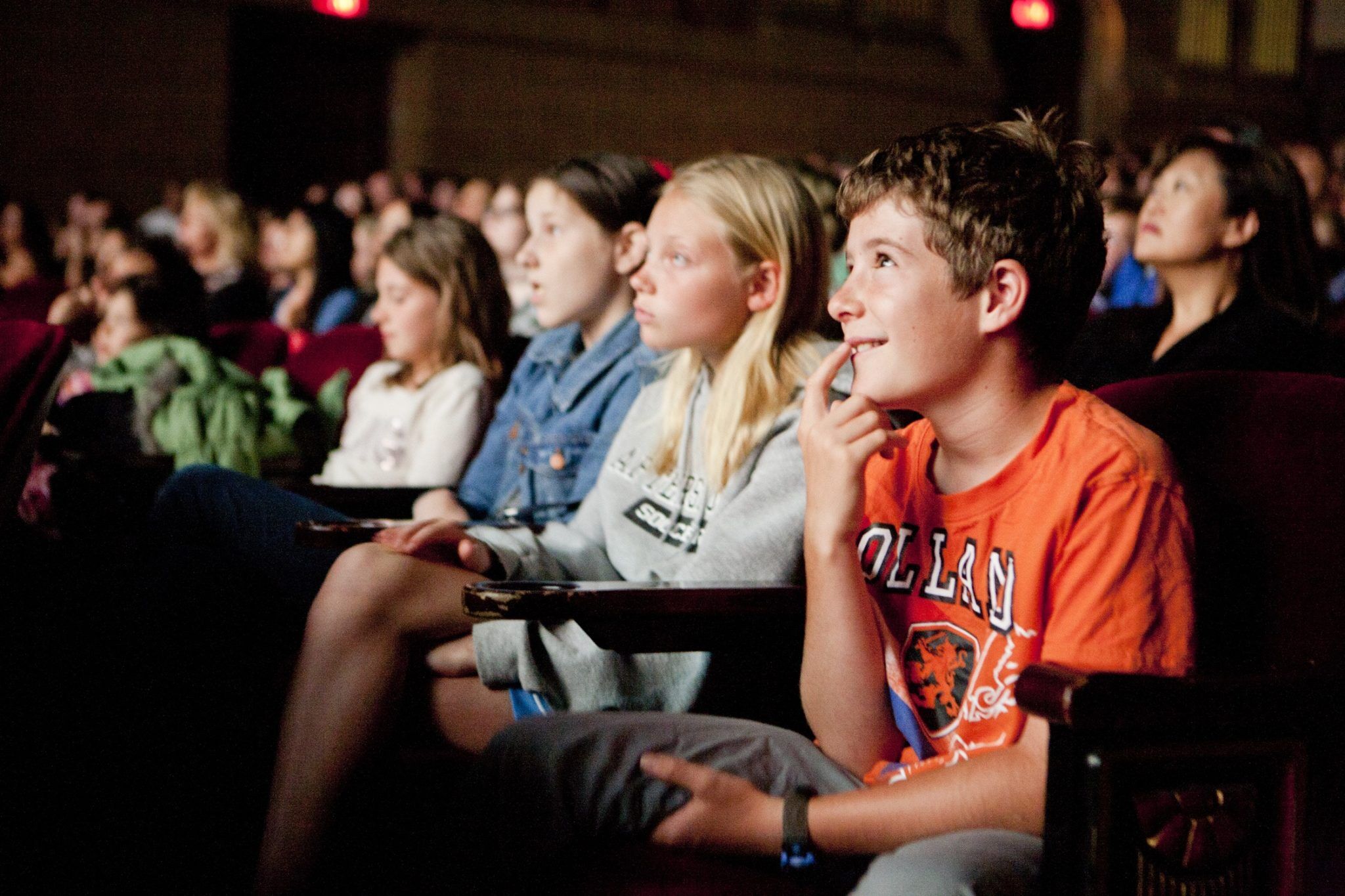 kids in a theater watching a film